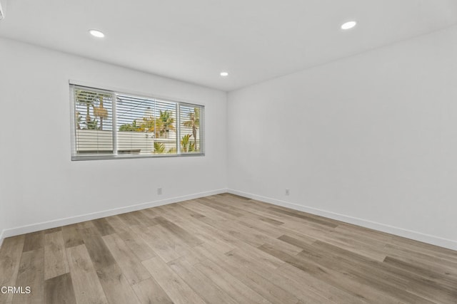 6721 S Springpark Ave Unit 3A, Los Angeles, CA 90056 - spare room featuring light wood-style floors, recessed lighting, and baseboards