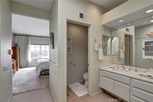 3511 Daffodil Ave Unit 14, Corona Del Mar, CA 92625 - bathroom featuring toilet, vanity, connected bathroom, and baseboards