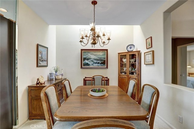3511 Daffodil Ave Unit 14, Corona Del Mar, CA 92625 - dining space with a chandelier, light carpet, and baseboards
