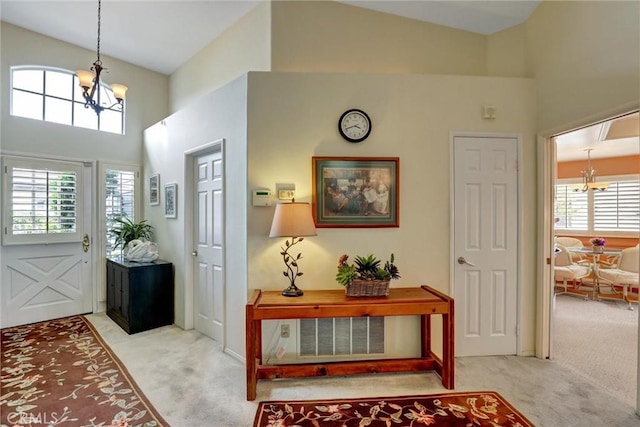 3511 Daffodil Ave Unit 14, Corona Del Mar, CA 92625 - entrance foyer featuring a chandelier, carpet flooring, and a high ceiling