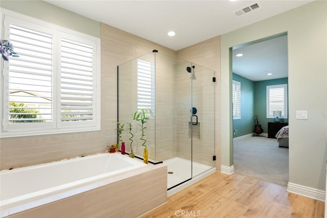 32106 Richardson St, Menifee, CA 92584 - ensuite bathroom with a garden tub, wood finished floors, a shower stall, baseboards, and recessed lighting