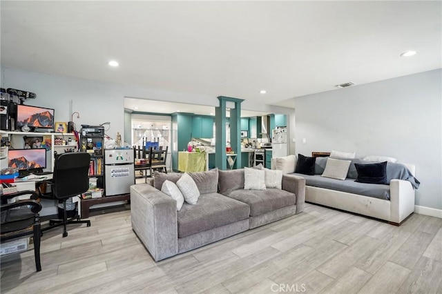 3336 Cherokee Ave, South Gate, CA 90280 - living room with a desk, light wood-style floors, and recessed lighting