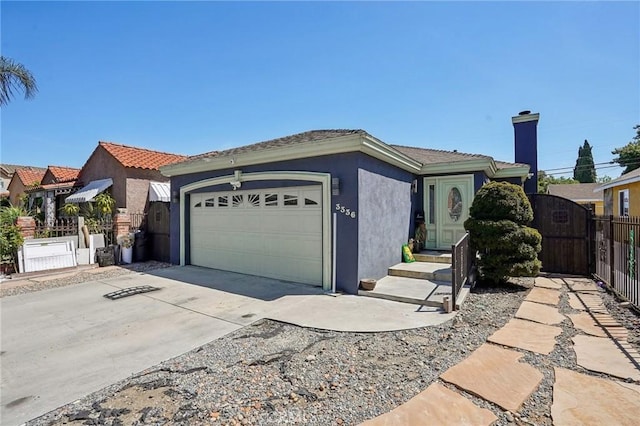 3336 Cherokee Ave, South Gate, CA 90280 - single story home featuring stucco siding, a garage, concrete driveway, a gate, and a chimney