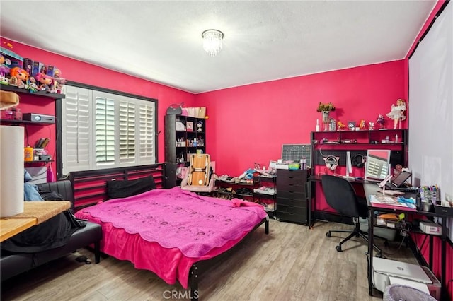 3336 Cherokee Ave, South Gate, CA 90280 - bedroom with wood finished floors and an office area