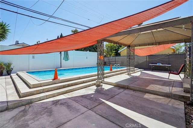 3336 Cherokee Ave, South Gate, CA 90280 - view of swimming pool featuring a fenced backyard, a patio, and a gazebo