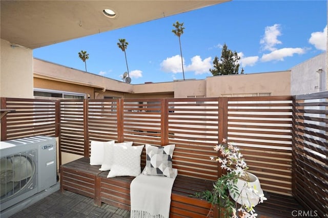 view of patio / terrace with fence and ac unit