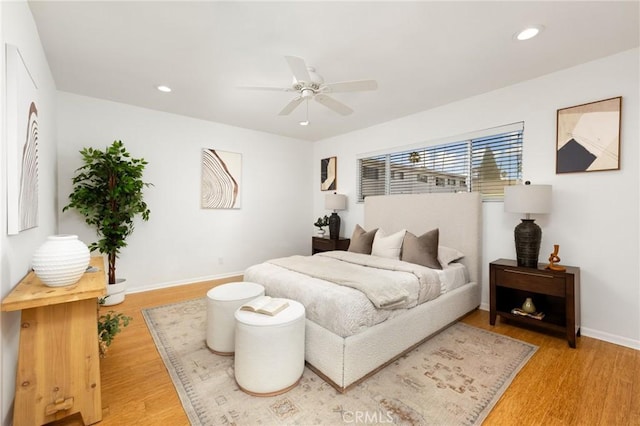 bedroom featuring light wood-type flooring, recessed lighting, baseboards, and a ceiling fan