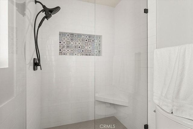 full bath featuring tiled shower
