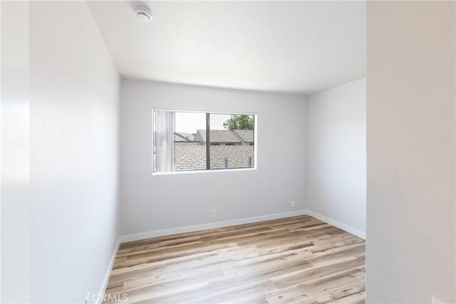 1485 W Cerritos Ave Unit 8, Anaheim, CA 92802 - empty room featuring light wood-style floors, baseboards, and a smoke detector
