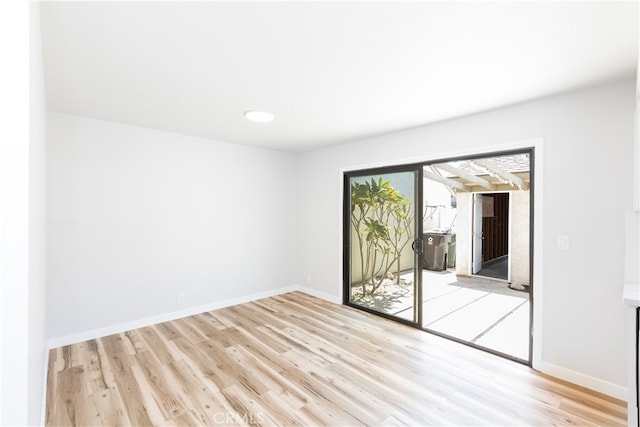 1485 W Cerritos Ave Unit 8, Anaheim, CA 92802 - empty room featuring light wood-style flooring, baseboards, and recessed lighting