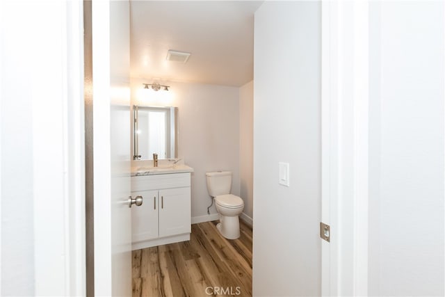 1485 W Cerritos Ave Unit 8, Anaheim, CA 92802 - bathroom with toilet, wood finished floors, vanity, and baseboards