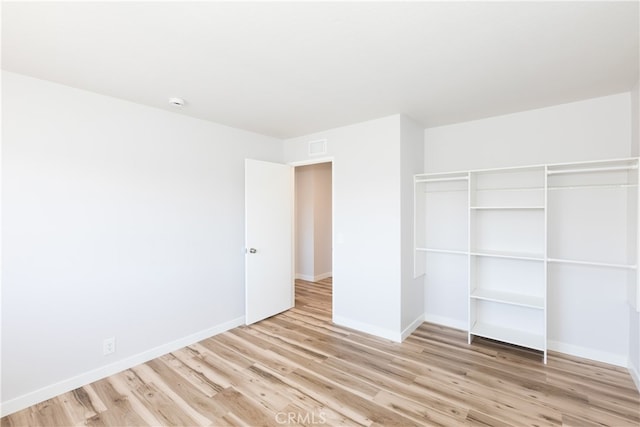 1485 W Cerritos Ave Unit 8, Anaheim, CA 92802 - unfurnished bedroom with wood finished floors, baseboards, and a closet