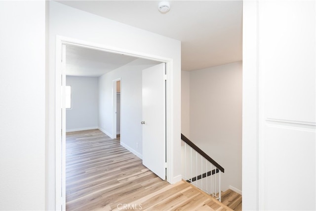 1485 W Cerritos Ave Unit 8, Anaheim, CA 92802 - hallway with an upstairs landing, light wood-style flooring, and baseboards