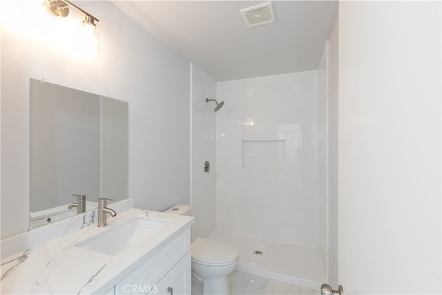1485 W Cerritos Ave Unit 8, Anaheim, CA 92802 - full bath featuring toilet, a tile shower, vanity, and marble look tiles