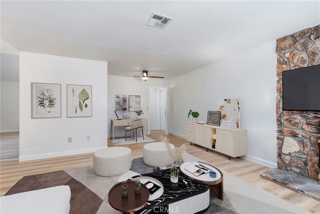 16230 Rodeo St, Hesperia, CA 92345 - living room with light wood finished floors, baseboards, and a ceiling fan
