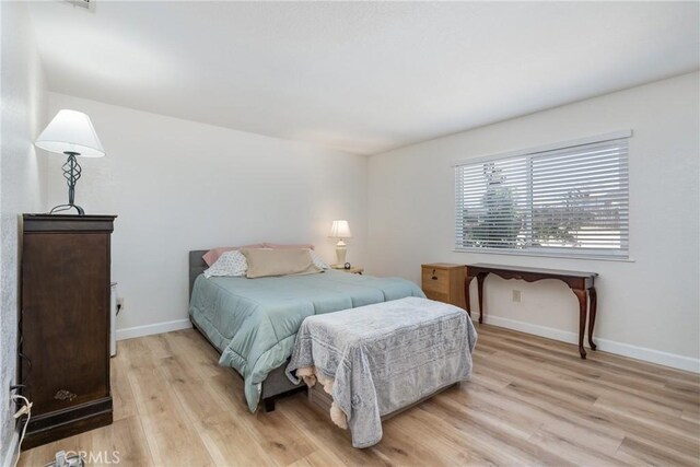 16230 Rodeo St, Hesperia, CA 92345 - bedroom with light wood finished floors and baseboards
