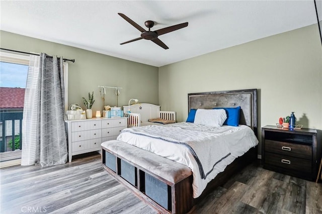 bedroom featuring wood finished floors and ceiling fan
