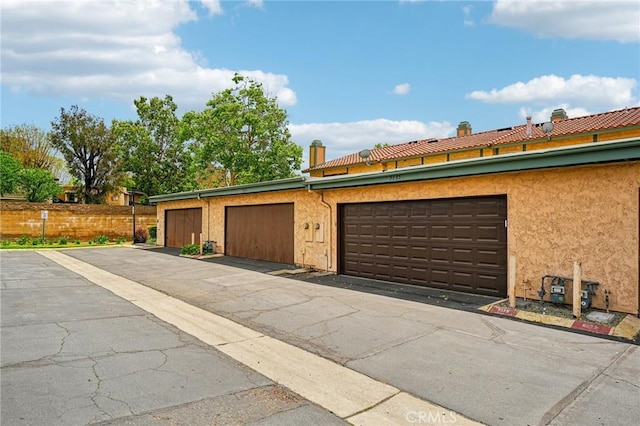 garage with fence