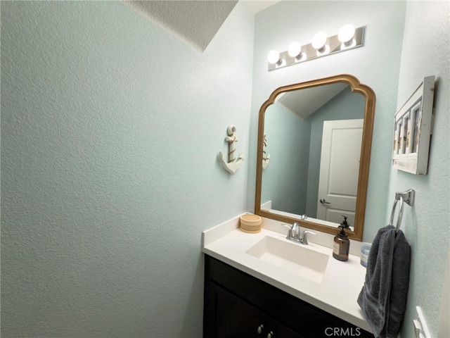 5485 San Roberto, San Diego, CA 92154 - bathroom featuring vanity and a textured wall