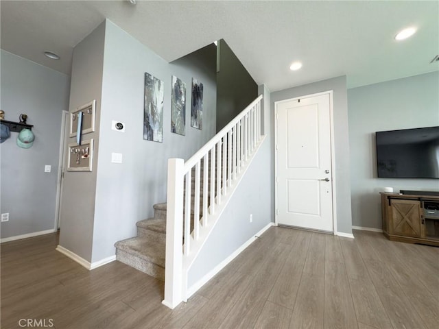 5485 San Roberto, San Diego, CA 92154 - stairway featuring wood finished floors, baseboards, and recessed lighting