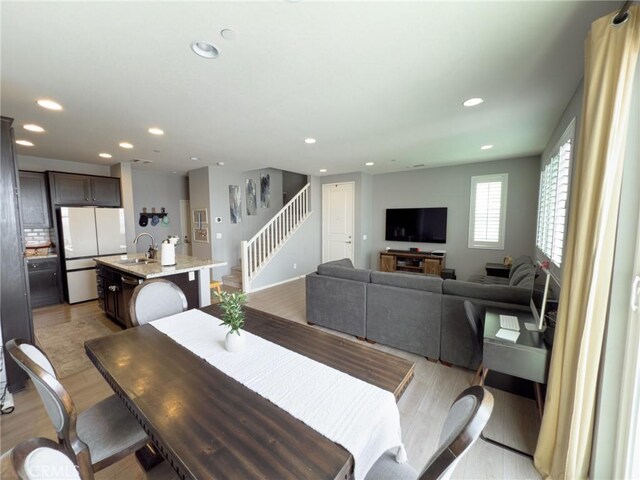 5485 San Roberto, San Diego, CA 92154 - dining area featuring stairs, recessed lighting, and light wood-style flooring