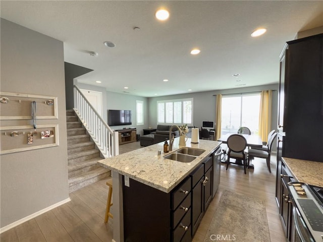 5485 San Roberto, San Diego, CA 92154 - kitchen with a sink, appliances with stainless steel finishes, recessed lighting, a kitchen bar, and an island with sink