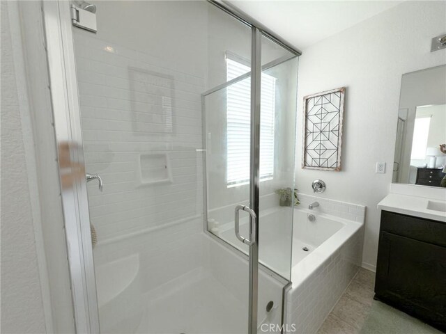 5485 San Roberto, San Diego, CA 92154 - full bath with vanity, a stall shower, a bath, and tile patterned floors