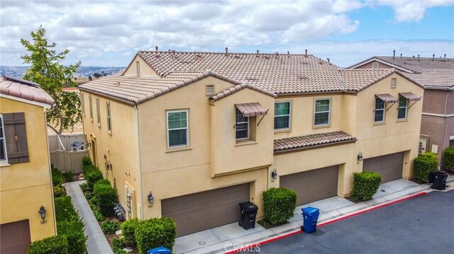 5485 San Roberto, San Diego, CA 92154 - view of front of home featuring a tiled roof, stucco siding, a garage, and driveway