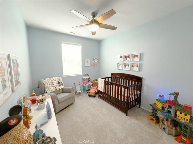 5485 San Roberto, San Diego, CA 92154 - bedroom featuring carpet, a crib, and ceiling fan