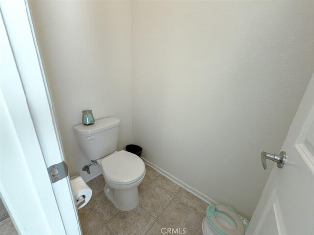 5485 San Roberto, San Diego, CA 92154 - bathroom featuring toilet, tile patterned floors, and baseboards