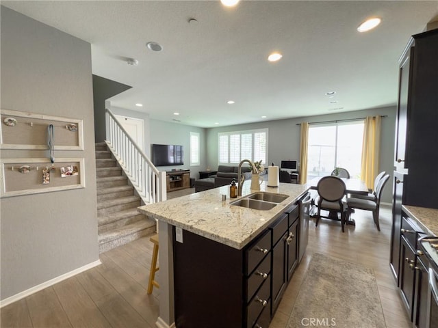5485 San Roberto, San Diego, CA 92154 - kitchen with a sink, a breakfast bar area, recessed lighting, stainless steel dishwasher, and a center island with sink