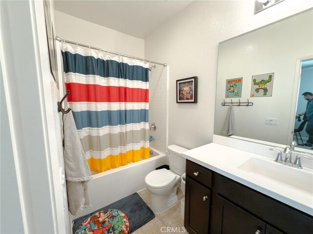 5485 San Roberto, San Diego, CA 92154 - bathroom featuring shower / bath combo with shower curtain, toilet, vanity, and tile patterned floors