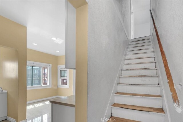 1017 W 99th St, Los Angeles, CA 90044 - staircase featuring recessed lighting