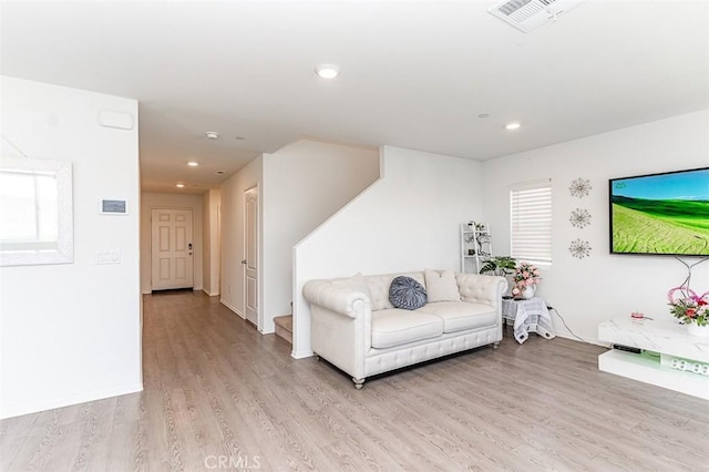 14205 Nicoles Way, Adelanto, CA 92301 - living area featuring light wood-style floors and recessed lighting