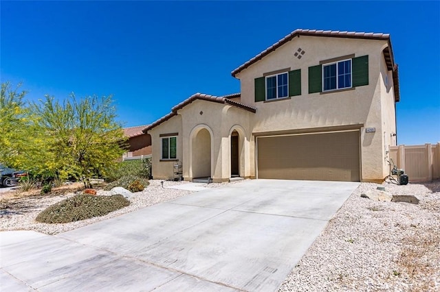 14205 Nicoles Way, Adelanto, CA 92301 - mediterranean / spanish home featuring stucco siding, a tiled roof, a garage, concrete driveway, and fence