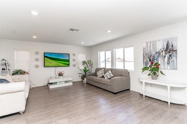 14205 Nicoles Way, Adelanto, CA 92301 - living area with wood finished floors and recessed lighting
