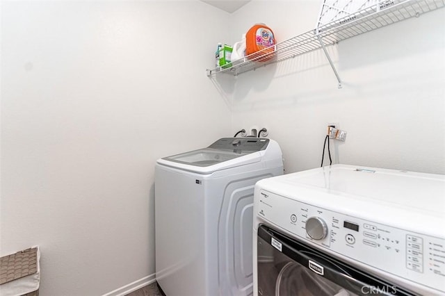 14205 Nicoles Way, Adelanto, CA 92301 - washroom with washer and dryer and baseboards