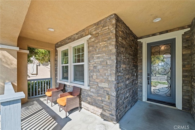 45936 Camino Rubi, Temecula, CA 92592 - view of exterior entry featuring a porch and stone siding