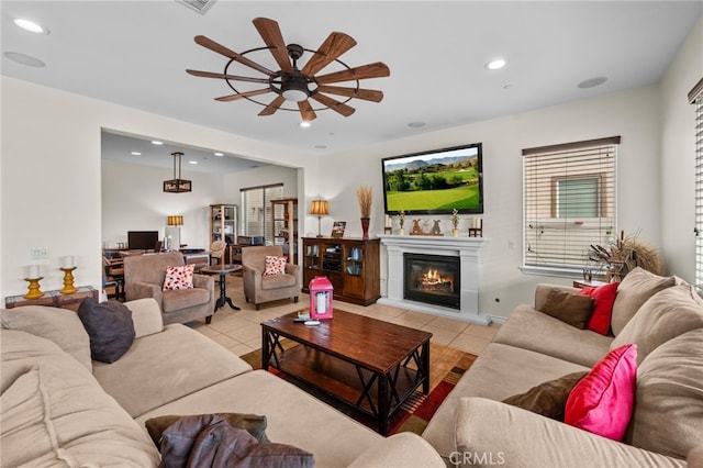 45936 Camino Rubi, Temecula, CA 92592 - living room with light tile patterned flooring, ceiling fan, recessed lighting, and a glass covered fireplace