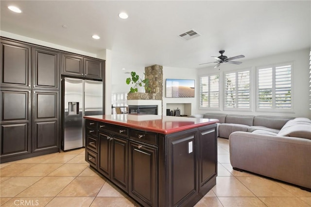 8519 E Kendra Loop, Orange, CA 92867 - kitchen featuring stainless steel fridge, light tile patterned floors, open floor plan, a ceiling fan, and recessed lighting