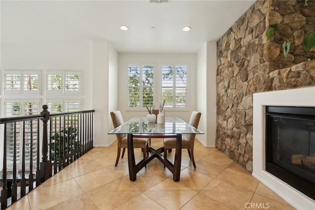 8519 E Kendra Loop, Orange, CA 92867 - dining area featuring a glass covered fireplace, recessed lighting, and light tile patterned floors