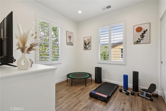 8519 E Kendra Loop, Orange, CA 92867 - exercise room with healthy amount of natural light, wood finished floors, baseboards, and recessed lighting