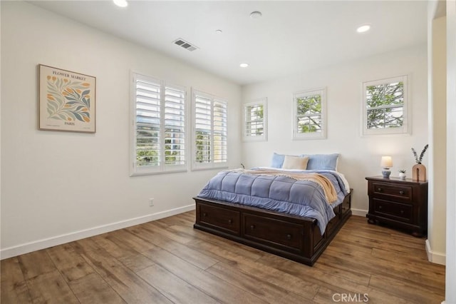 8519 E Kendra Loop, Orange, CA 92867 - bedroom with multiple windows, hardwood / wood-style floors, baseboards, and recessed lighting