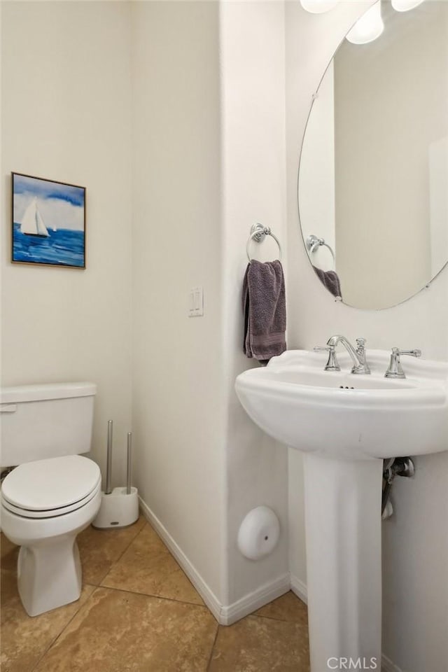 8519 E Kendra Loop, Orange, CA 92867 - bathroom with tile patterned flooring, toilet, baseboards, and a sink