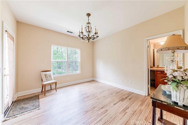 45975 Sandia Creek Dr, Temecula, CA 92590 - living area featuring a chandelier, light wood-type flooring, and baseboards