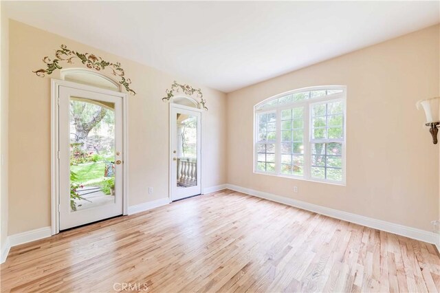 45975 Sandia Creek Dr, Temecula, CA 92590 - empty room with plenty of natural light, light wood-style floors, and baseboards