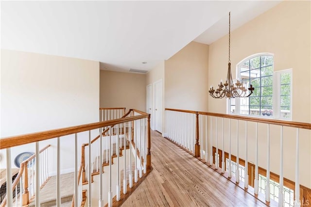 45975 Sandia Creek Dr, Temecula, CA 92590 - corridor with a chandelier, wood finished floors, and an upstairs landing