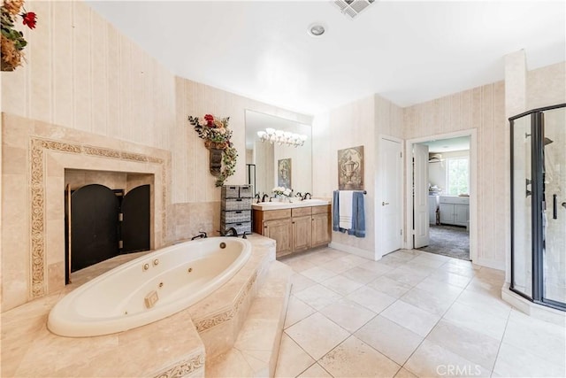 45975 Sandia Creek Dr, Temecula, CA 92590 - full bathroom featuring a shower stall, vanity, a jetted tub, a chandelier, and wallpapered walls