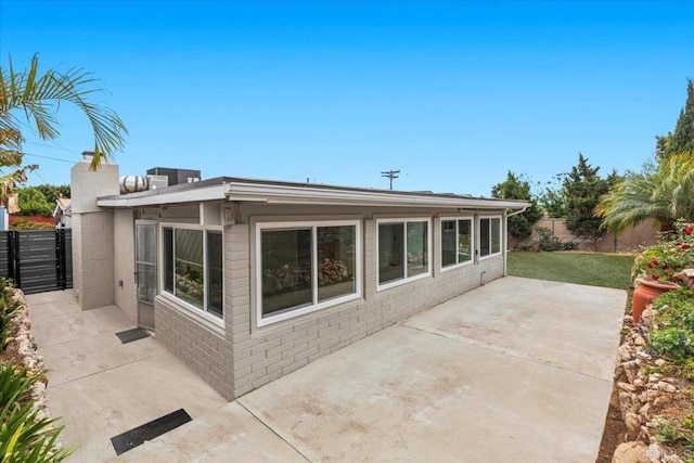 4566 Derrick Dr, San Diego, CA 92117 - rear view of house featuring a patio and fence