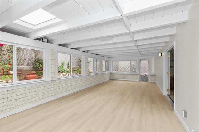 4566 Derrick Dr, San Diego, CA 92117 - unfurnished sunroom with wood finished floors, beam ceiling, and baseboards